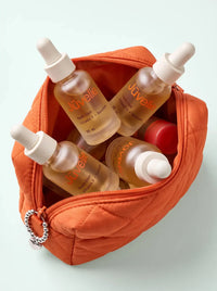 Youth Elixir in an orange travel pouch